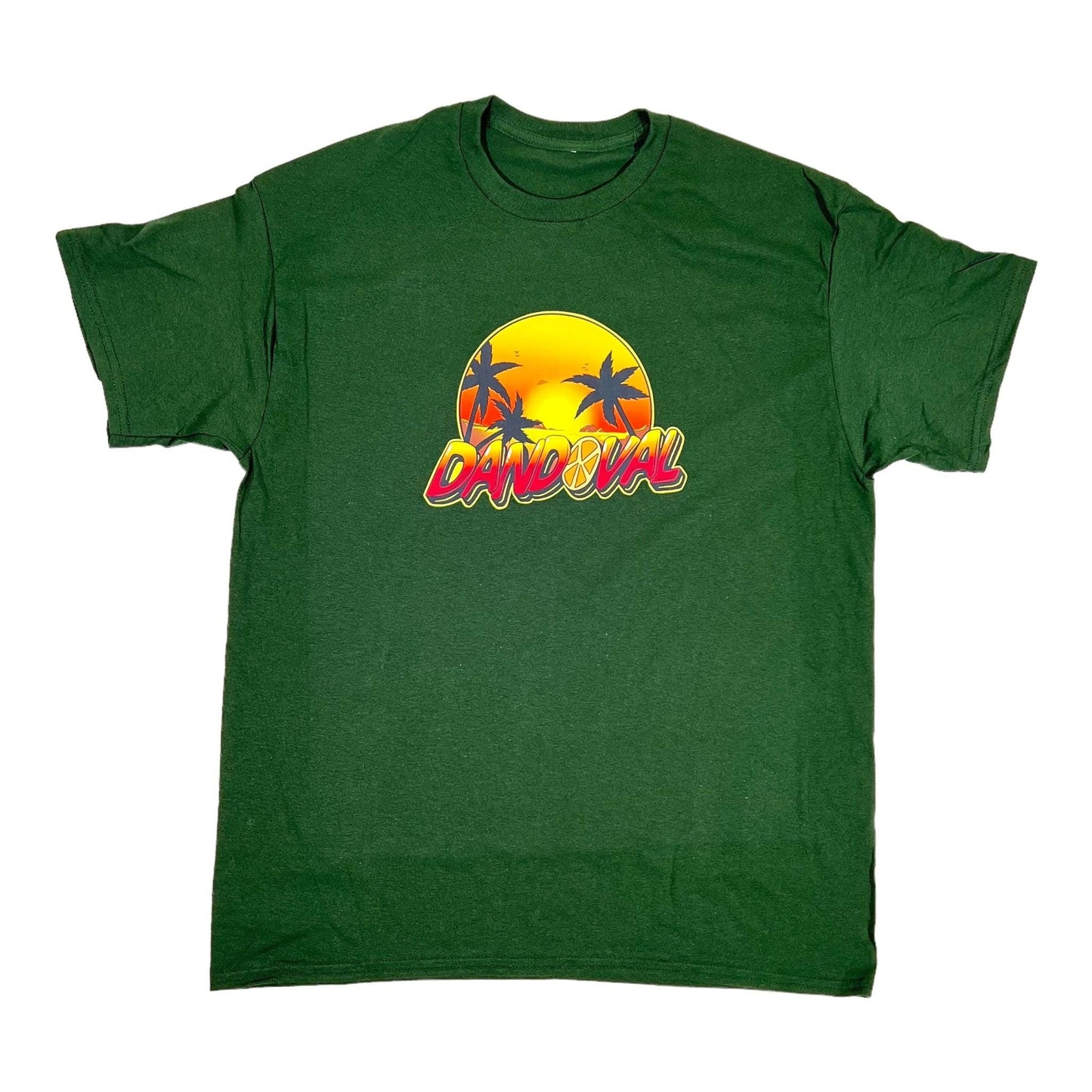 Green t-shirt with a 'Carnival' graphic design featuring palm trees and a sunset on a white background.