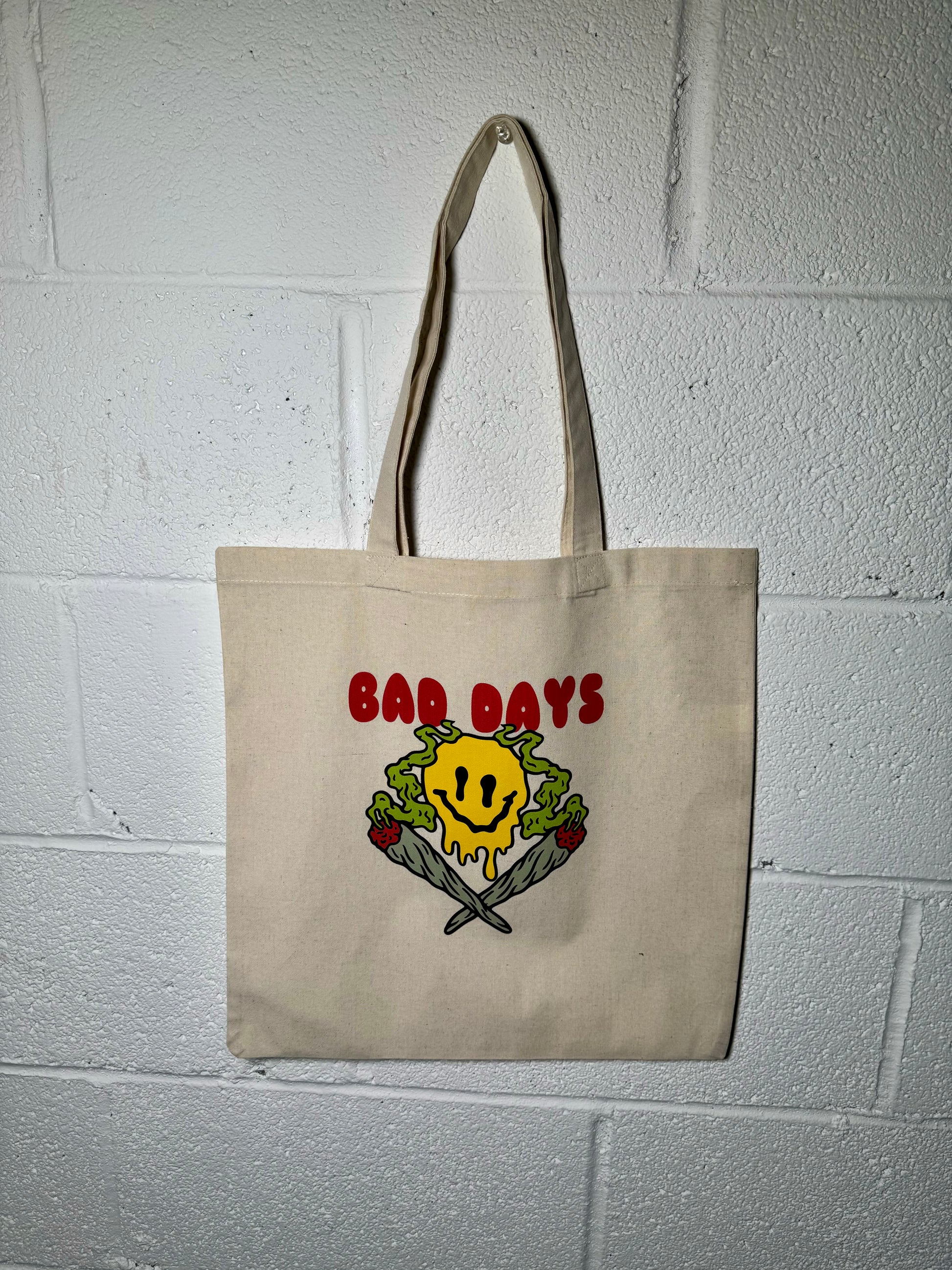 Front view of Bad Days Canvas Tote with bold "Bad Days" print, made from 100% cotton canvas.