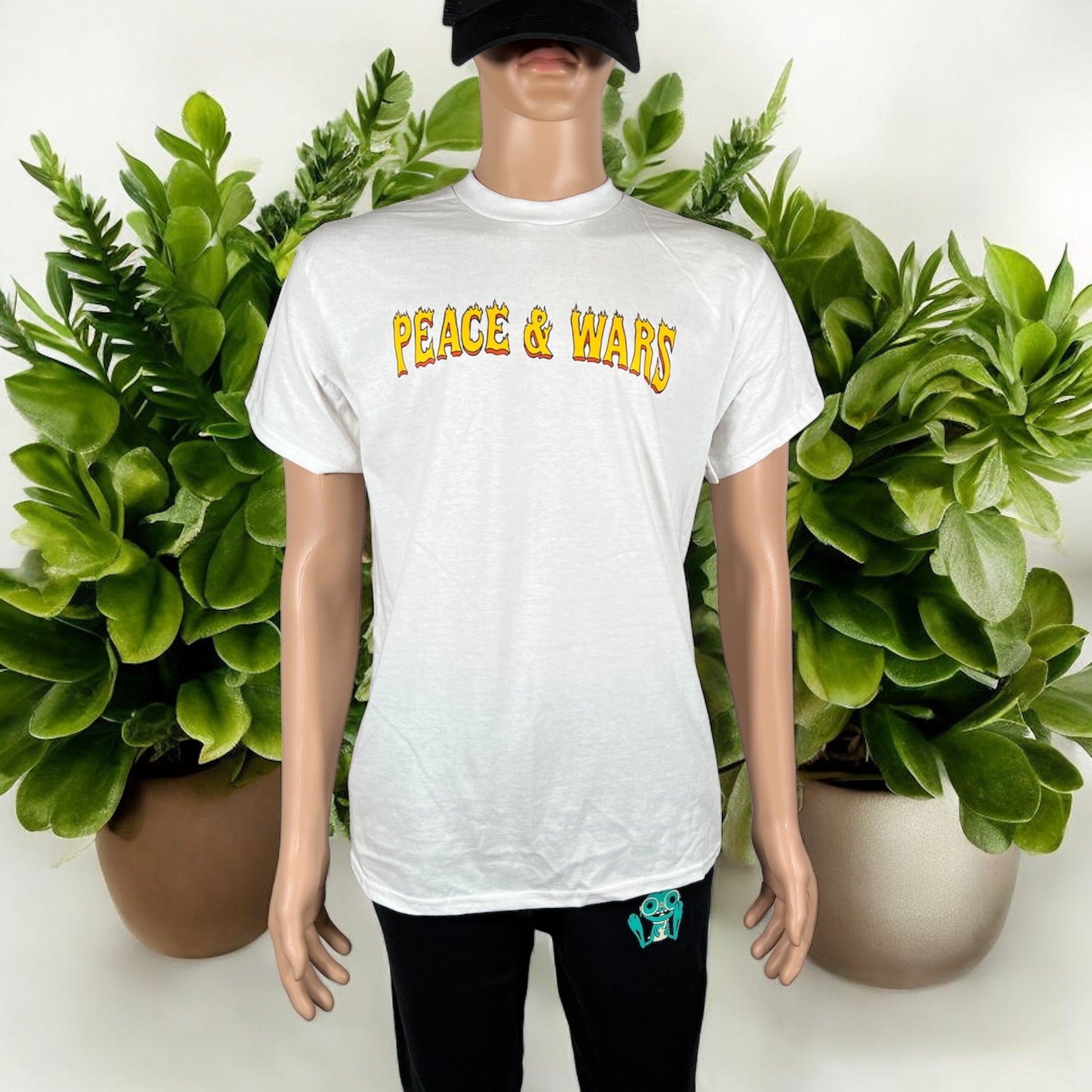 "Peace & Wars OG Logo T-Shirt featuring iconic design, made from 100% combed ringspun cotton, unisex fit, perfect for sci-fi and alien invasion fans." 