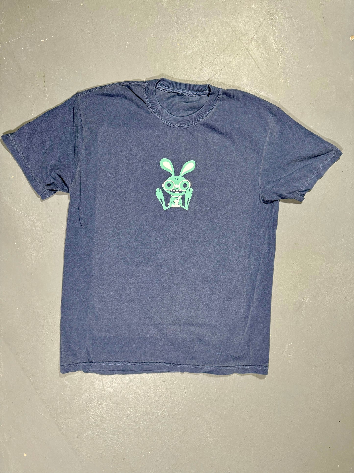 "Front view of Bunny T-Shirt by fashionINK in denim color, featuring exclusive front print design, crafted from 100% ringspun cotton with soft-washed, garment-dyed heavyweight fabric for high-quality fashion."