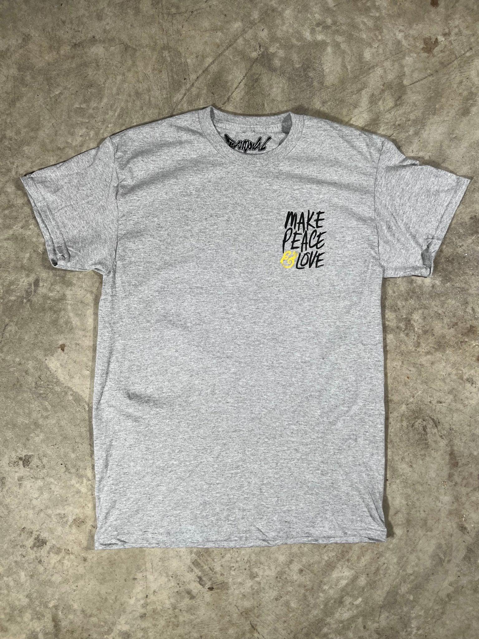 Gray t-shirt with 'Make Peace Love' text on a textured surface