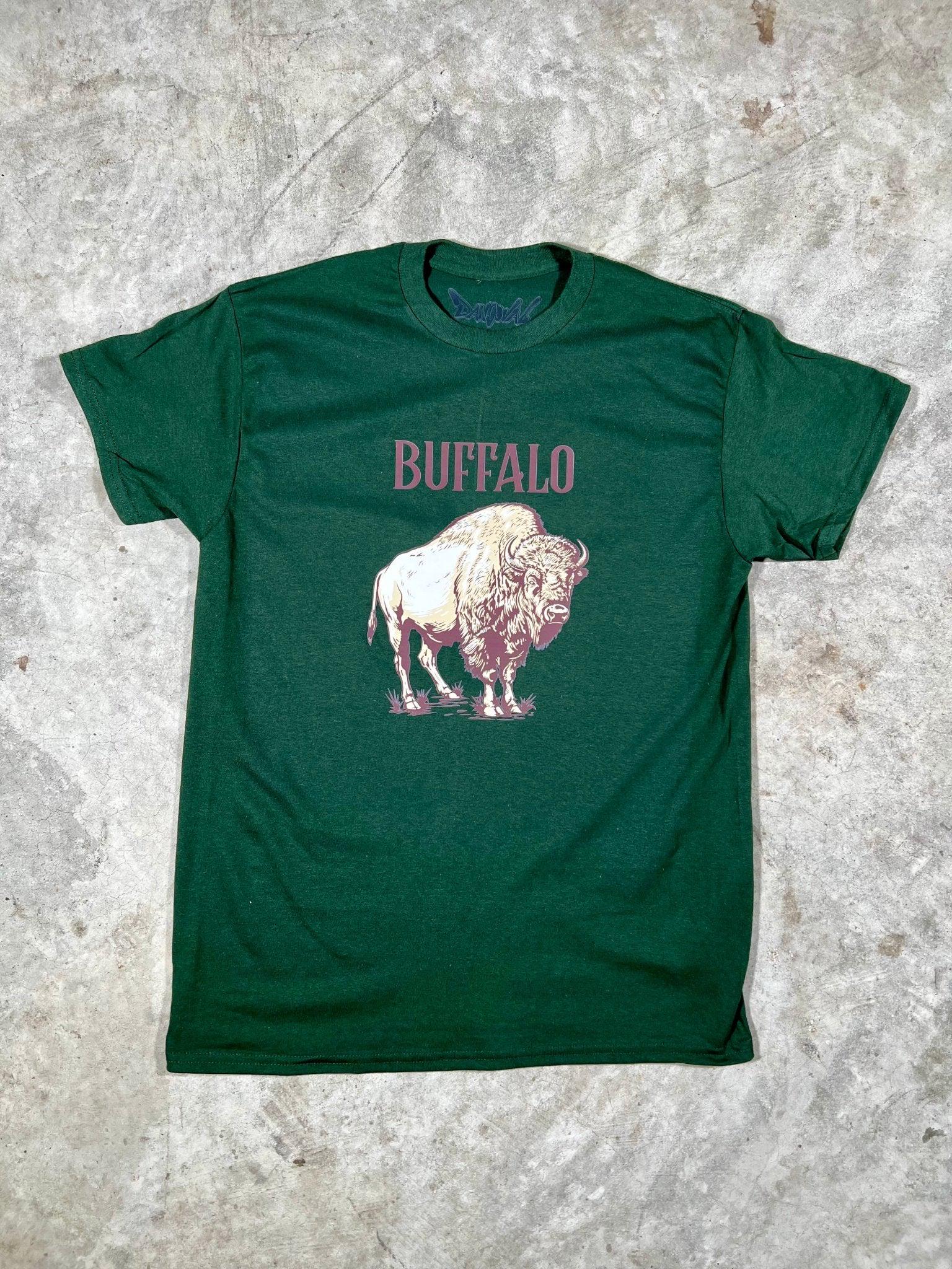 Green t-shirt with a pink buffalo graphic and 'BUFFALO' text on a textured gray background
