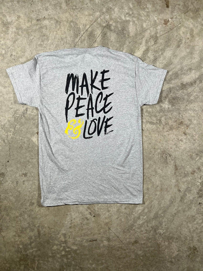 Gray t-shirt with 'Make Peace Love' text on a textured surface