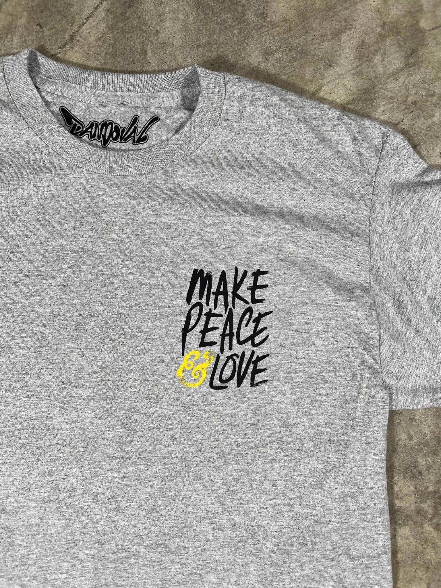 Gray t-shirt with 'Make Peace By Love' text on a textured surface