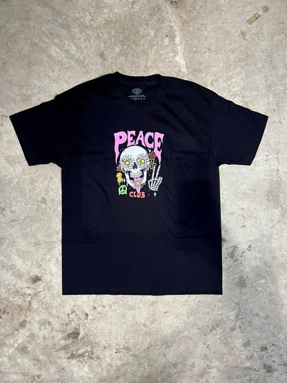 Black t-shirt with a colorful graphic design on a textured gray surface