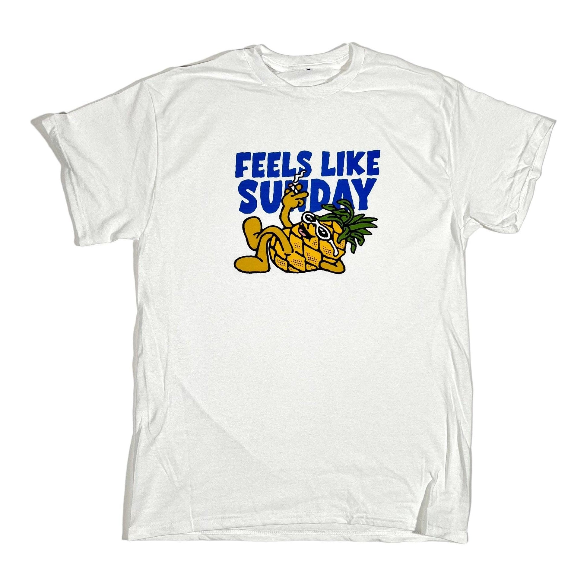 White t-shirt with a graphic of a tiger and pineapple, and 'Feels Like Sunday' text on a white background.