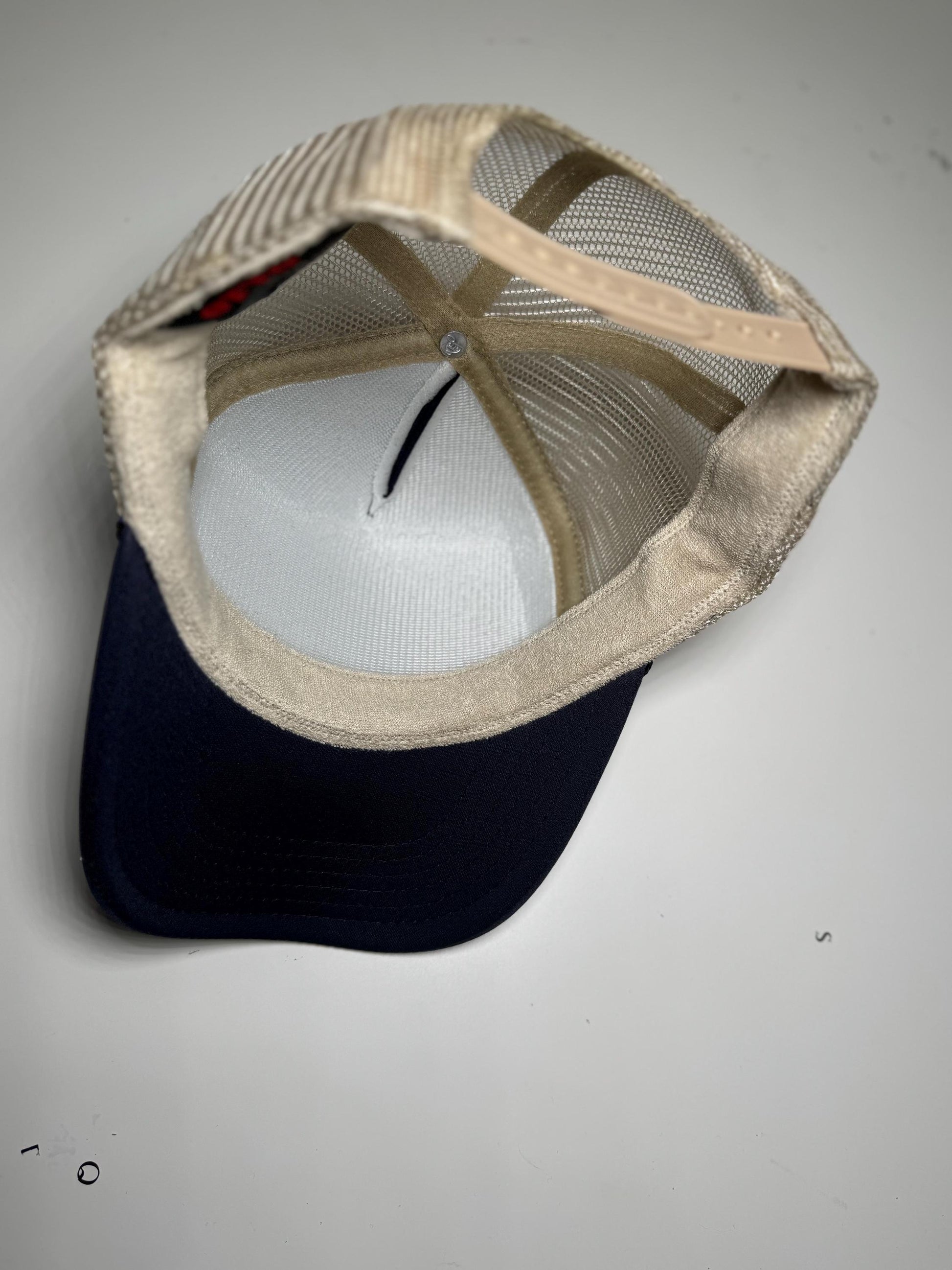 Baseball cap with mesh back on a gray background